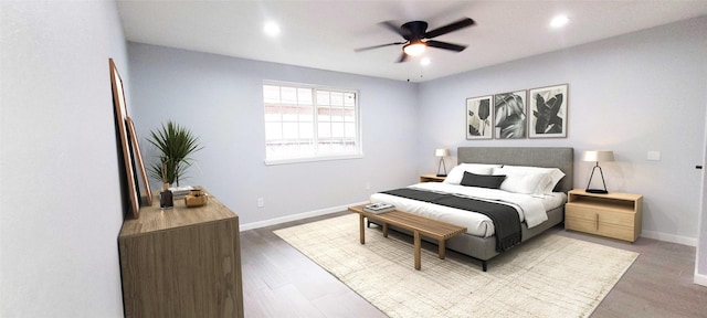 bedroom with ceiling fan and wood-type flooring