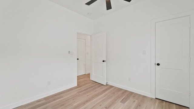 spare room featuring ceiling fan and light hardwood / wood-style flooring