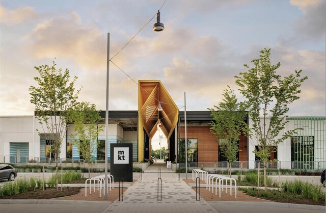 view of outdoor building at dusk