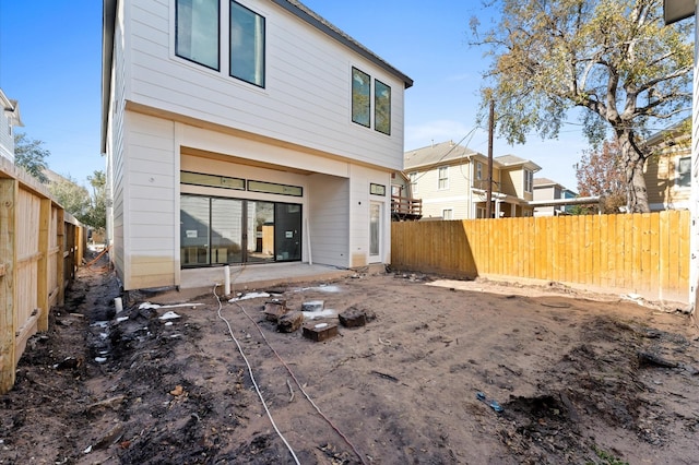 back of property with a patio area