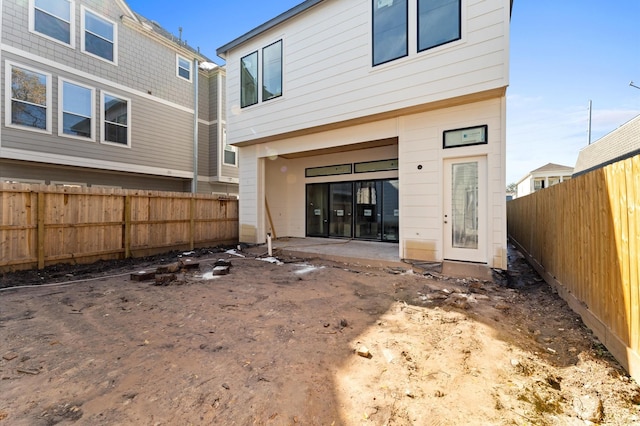 rear view of house featuring a patio