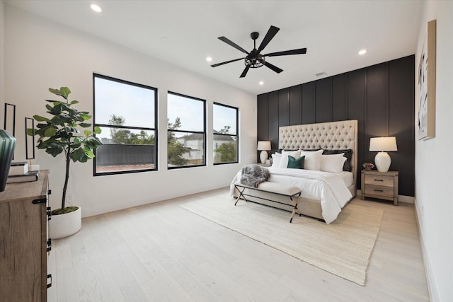 bedroom featuring ceiling fan and light hardwood / wood-style floors