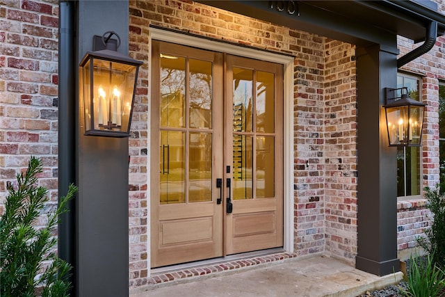 view of exterior entry featuring french doors