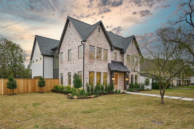 view of front of home with a lawn