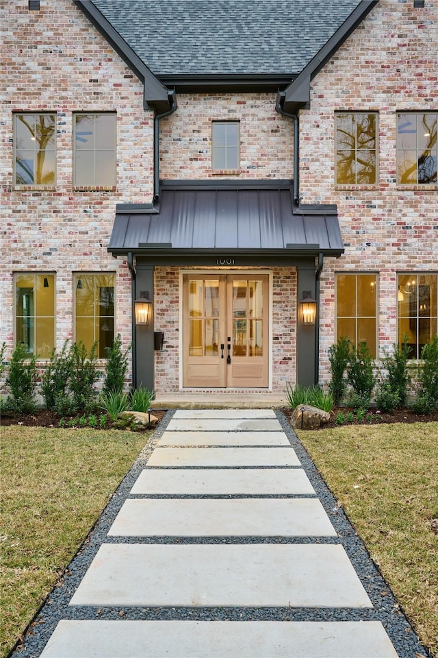 property entrance with french doors and a yard