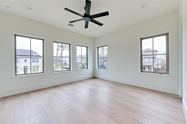 unfurnished room featuring ceiling fan and light hardwood / wood-style floors