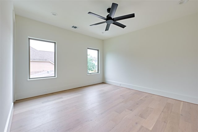 spare room with ceiling fan and light hardwood / wood-style floors