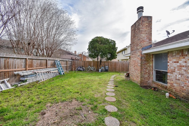 view of yard featuring a fenced backyard