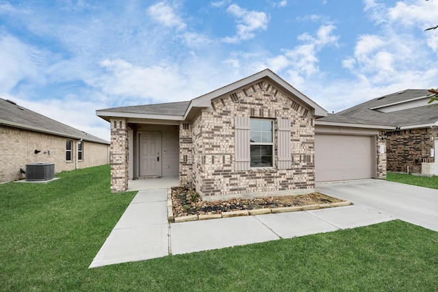 view of front facade featuring a garage, central air condition unit, and a front lawn