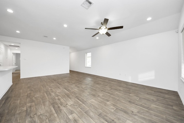 unfurnished room with hardwood / wood-style floors and ceiling fan