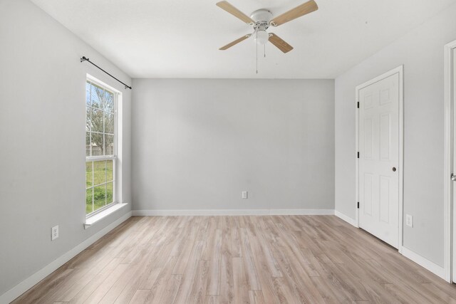 unfurnished room featuring ceiling fan and light hardwood / wood-style floors