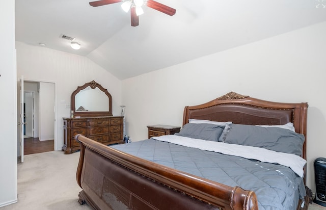 bedroom with light colored carpet, vaulted ceiling, and ceiling fan