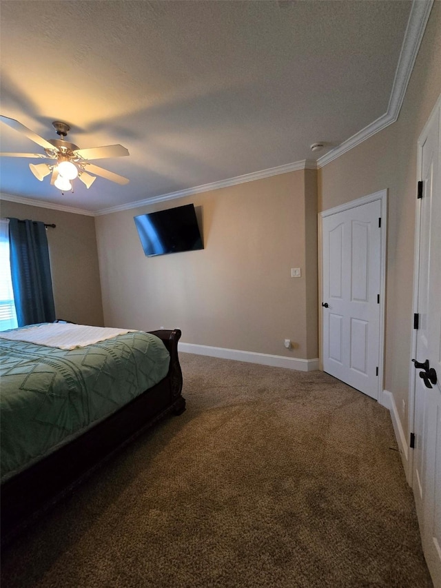 bedroom with ceiling fan, crown molding, and carpet floors