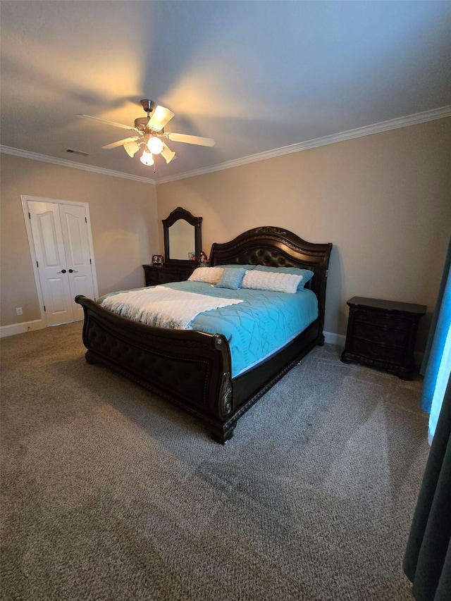 carpeted bedroom featuring ceiling fan, a closet, and ornamental molding