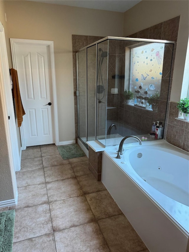 bathroom with separate shower and tub