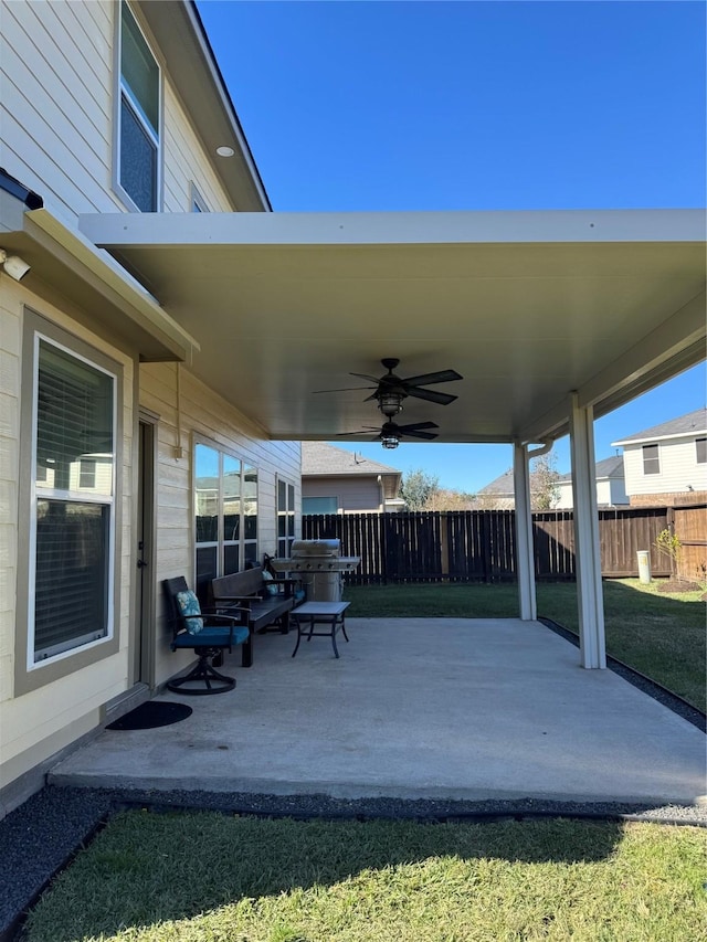 view of patio featuring ceiling fan