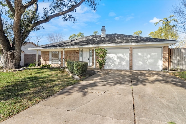 ranch-style house with a garage and a front yard