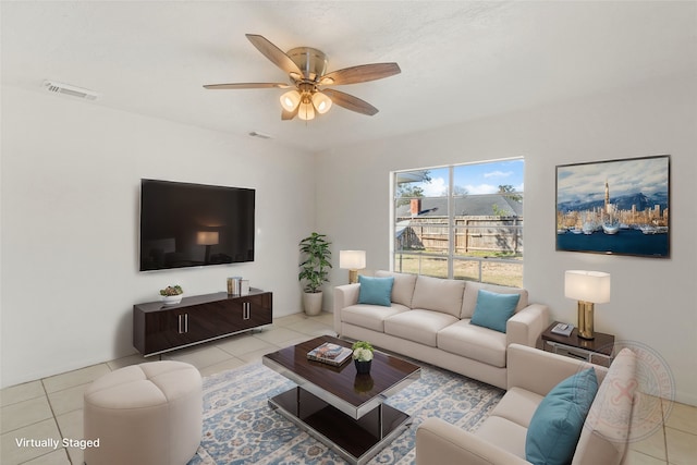 tiled living room featuring ceiling fan