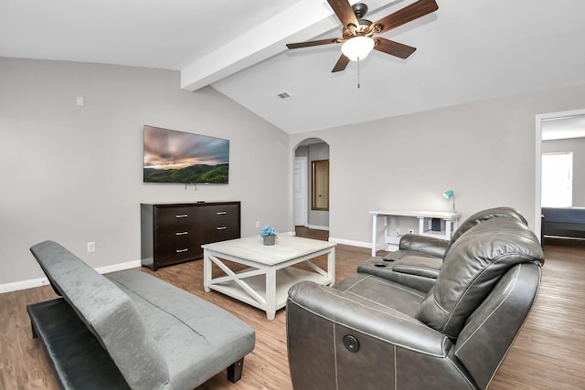 living room with vaulted ceiling with beams, ceiling fan, and hardwood / wood-style flooring