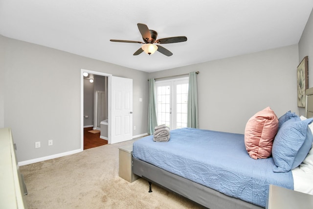 bedroom with carpet, ensuite bathroom, and ceiling fan