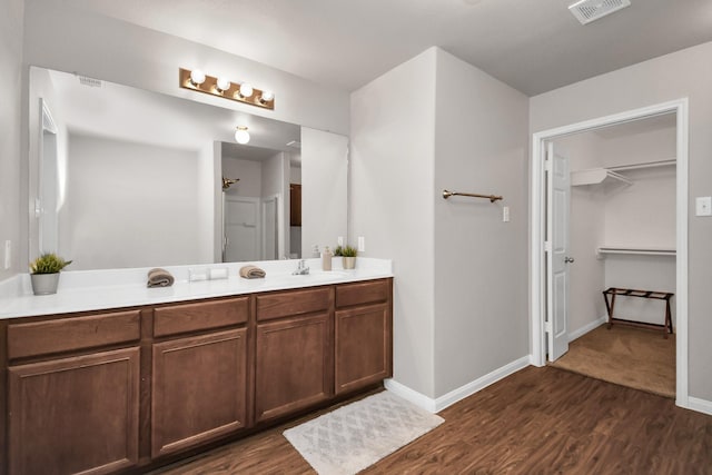 bathroom featuring hardwood / wood-style floors and vanity