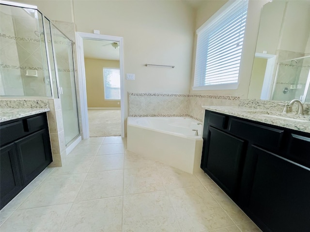 bathroom with tile patterned floors, ceiling fan, vanity, and shower with separate bathtub