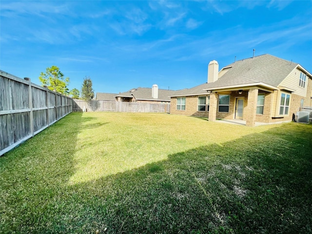 view of yard with central AC unit