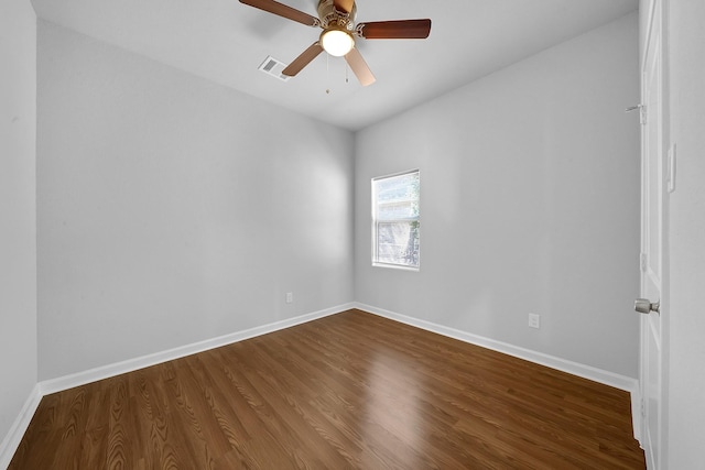 spare room with hardwood / wood-style floors and ceiling fan