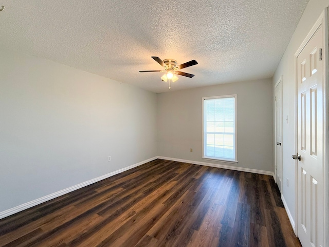 unfurnished bedroom featuring a textured ceiling, dark hardwood / wood-style floors, and ceiling fan