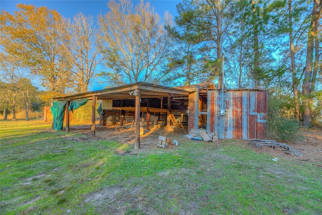 view of outdoor structure with a lawn