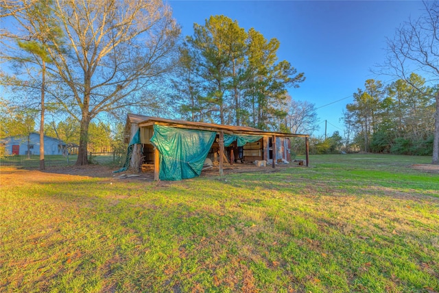 view of outbuilding with a lawn