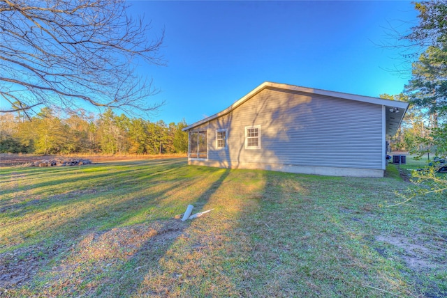 view of property exterior with a yard