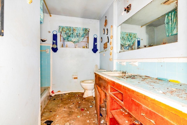 bathroom with decorative backsplash, a bath, vanity, and toilet