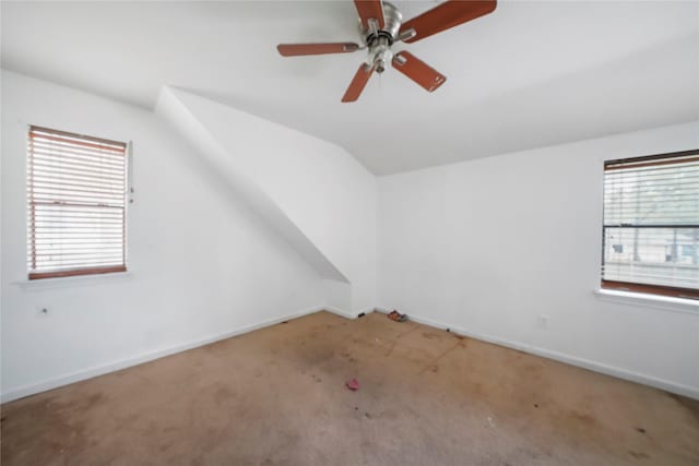 additional living space featuring lofted ceiling, ceiling fan, and carpet floors