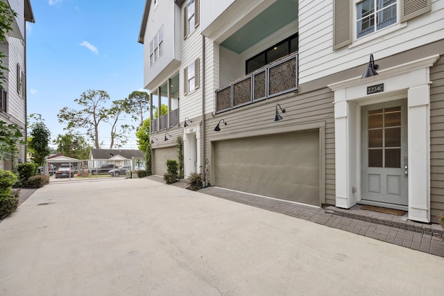 view of side of property with a garage