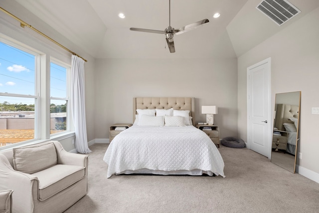 carpeted bedroom with vaulted ceiling and ceiling fan