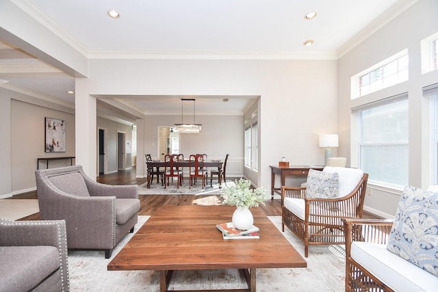 living room with ornamental molding and light wood-type flooring