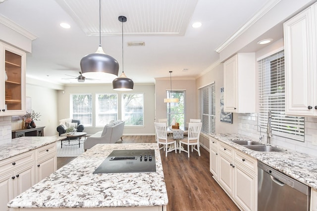 kitchen featuring black electric stovetop, tasteful backsplash, sink, dishwasher, and white cabinetry