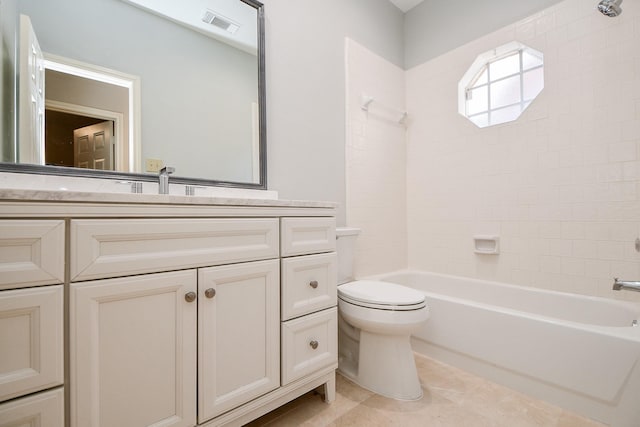 full bathroom featuring tile patterned floors, toilet, vanity, and tiled shower / bath