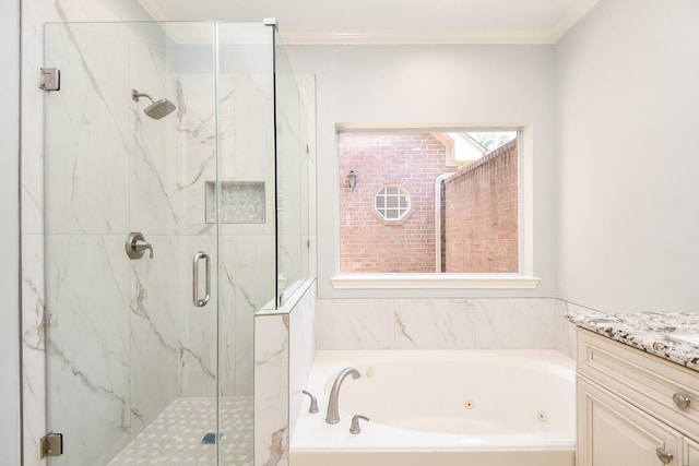 bathroom featuring plus walk in shower, vanity, and ornamental molding