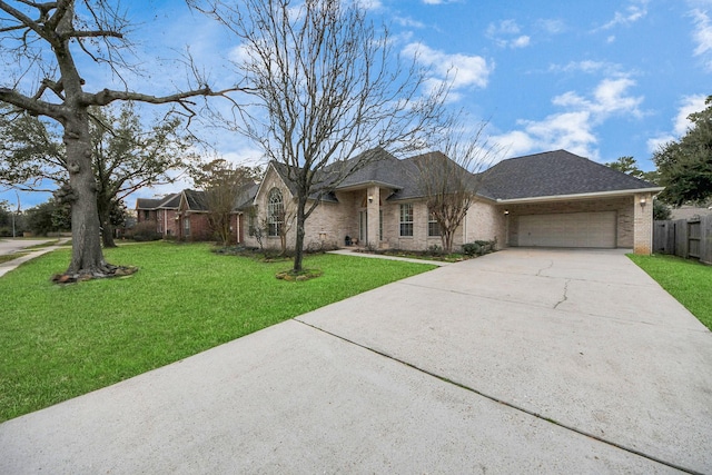 ranch-style house with a garage and a front yard