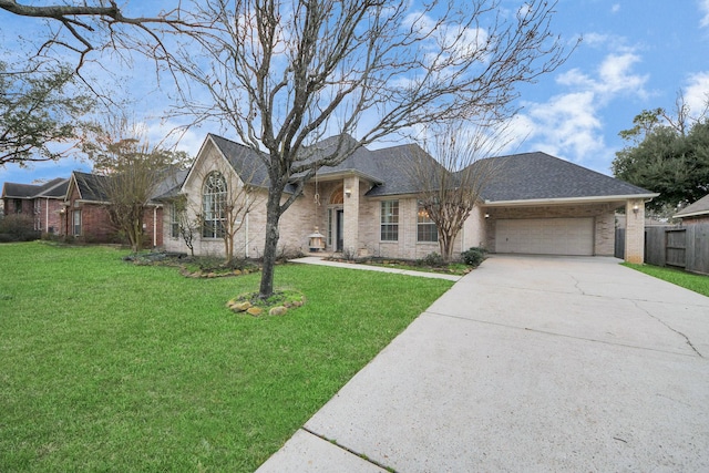 view of front of home featuring a garage and a front lawn