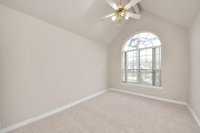 unfurnished room with light carpet, ceiling fan, high vaulted ceiling, and beamed ceiling