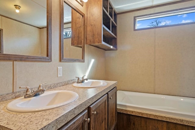 bathroom featuring a bathing tub and vanity