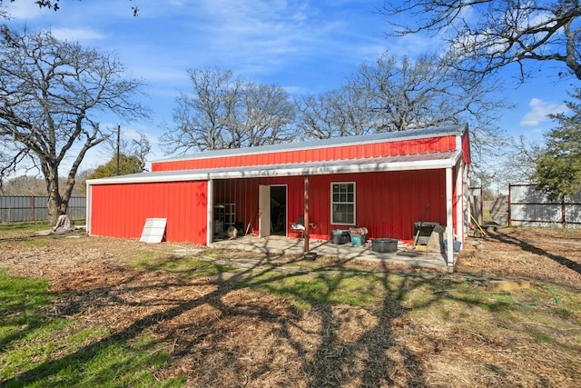 rear view of house with an outbuilding