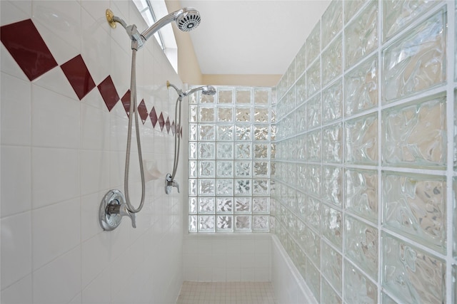 bathroom with a tile shower