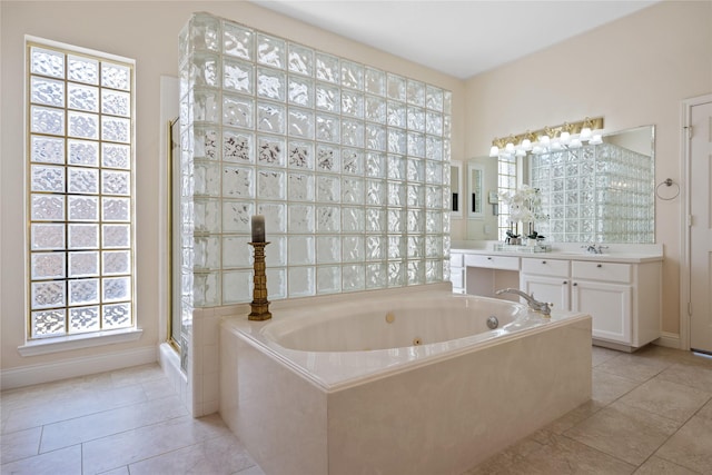 bathroom featuring independent shower and bath, tile patterned floors, and vanity