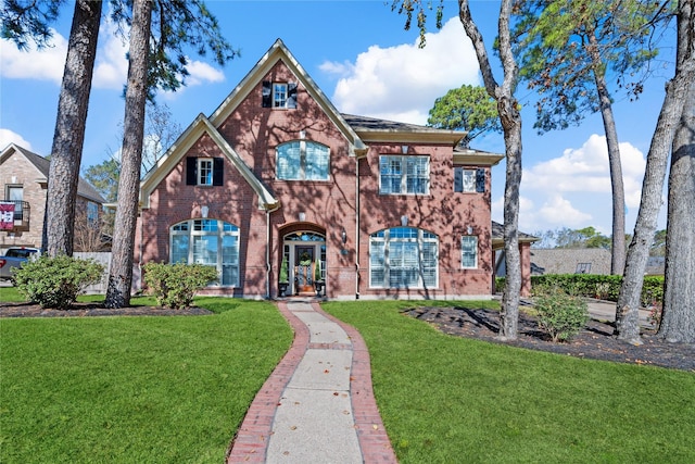 view of front of home with a front lawn