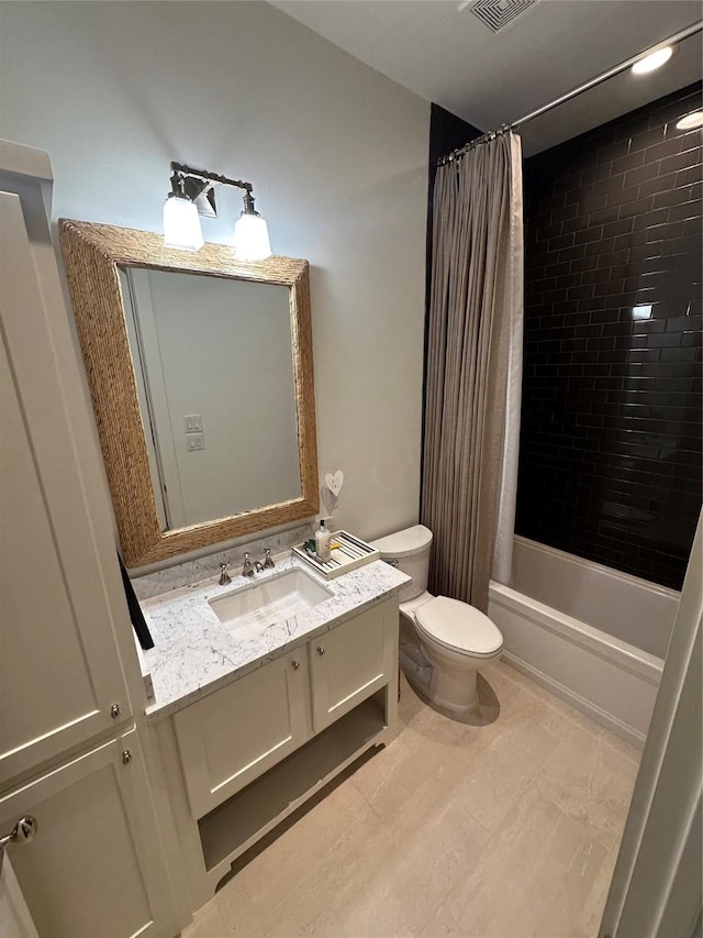 full bathroom featuring vanity, toilet, and shower / tub combo with curtain