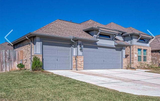 view of front facade with a garage and a front yard